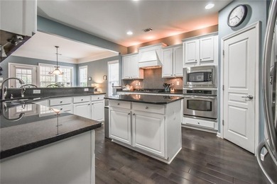 Welcome to this beautifully maintained four-bedroom, three-bath