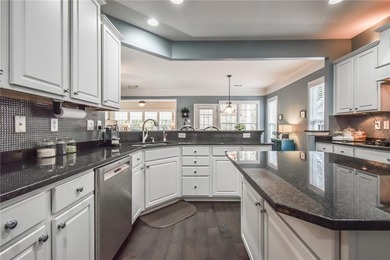 Welcome to this beautifully maintained four-bedroom, three-bath