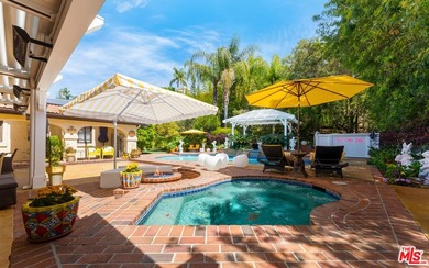 Welcome to this magnificent Spanish-style estate in the - photo 22
