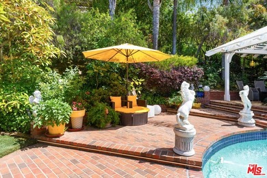 Welcome to this magnificent Spanish-style estate in the - photo 23