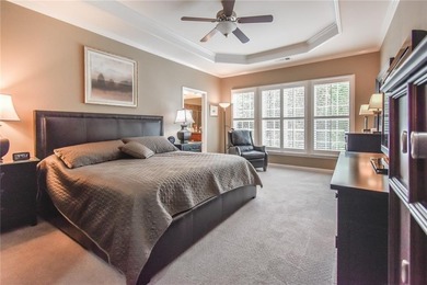 Welcome to this beautifully maintained four-bedroom, three-bath