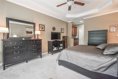 Welcome to this beautifully maintained four-bedroom, three-bath