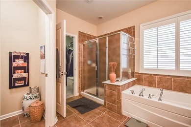 Welcome to this beautifully maintained four-bedroom, three-bath