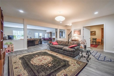 Welcome to this beautifully maintained four-bedroom, three-bath