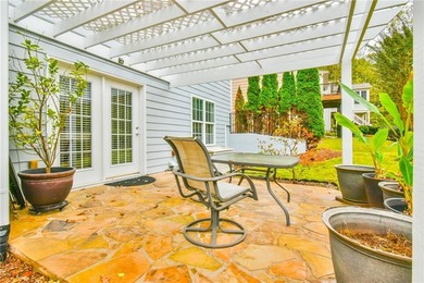 Welcome to this beautifully maintained four-bedroom, three-bath