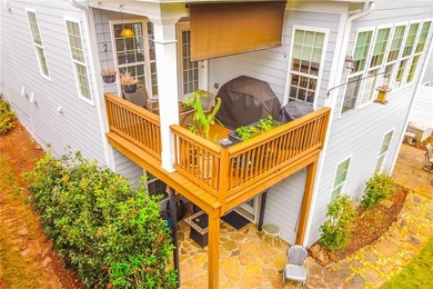 Welcome to this beautifully maintained four-bedroom, three-bath