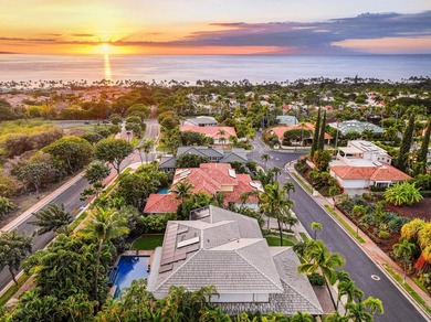 Located in the desirable gated community of Wailea Kialoa, this - photo 2