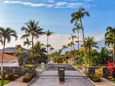 Located in the desirable gated community of Wailea Kialoa, this - photo 3