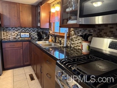 Experience true Northwoods living with this charming waterfront - photo 5