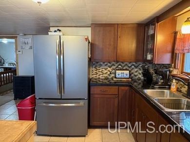 Experience true Northwoods living with this charming waterfront - photo 6