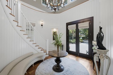 Experience refined coastal living within the prestigious, gated - photo 3