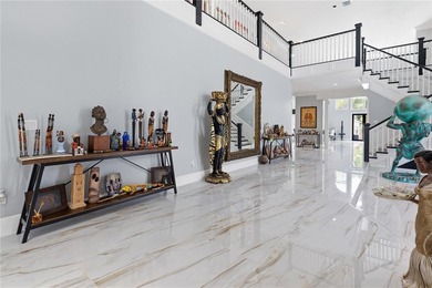This 7-bedroom, 10-bathroom mini mansion is located in an - photo 3