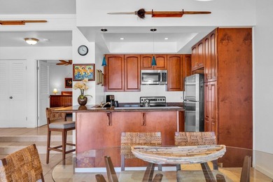 Ocean and fairway views from this beautifully upgraded unit with - photo 3