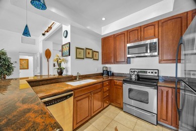 Ocean and fairway views from this beautifully upgraded unit with - photo 5