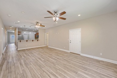 As you step inside, you are greeted with an open floor plan that - photo 7