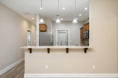 As you step inside, you are greeted with an open floor plan that - photo 9
