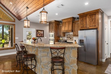 Experience peaceful waterfront living with this custom-built - photo 9