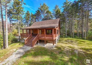 Lake Placid custom new completed log home is being offered for - photo 1