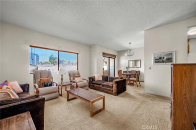 Welcome to this well-maintained top-floor unit located in the