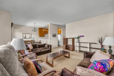 Welcome to this well-maintained top-floor unit located in the