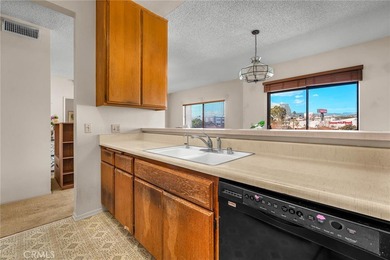 Welcome to this well-maintained top-floor unit located in the