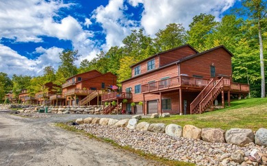 Discover the epitome of Adirondack luxury at The Lodges, the - photo 2