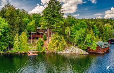 Kiwassa Lake Lodge sits above the shoreline in a way that - photo 1