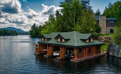 Kiwassa Lake Lodge sits above the shoreline in a way that - photo 4