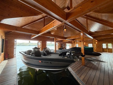 Kiwassa Lake Lodge sits above the shoreline in a way that - photo 5