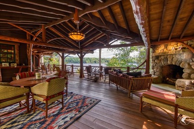 Kiwassa Lake Lodge sits above the shoreline in a way that - photo 8