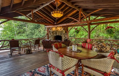 Kiwassa Lake Lodge sits above the shoreline in a way that - photo 9