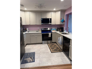 Welcome to this charming single-family home in Port Charlotte! - photo 3