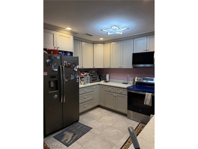 Welcome to this charming single-family home in Port Charlotte! - photo 4