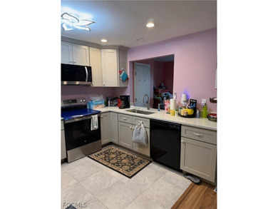 Welcome to this charming single-family home in Port Charlotte! - photo 5