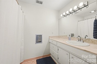 Own a piece of Charlotte history in this unique Mid-Century