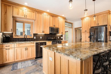 Discover luxury lakeside living in this custom-built 3-bedroom - photo 6