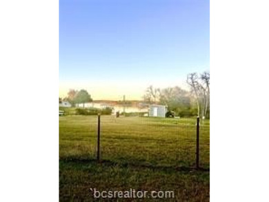Come take a look at this waterfront lot. Has a small cabin - photo 3