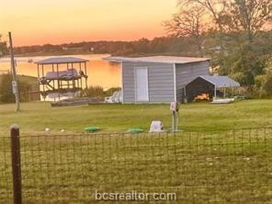 Come take a look at this waterfront lot. Has a small cabin - photo 7