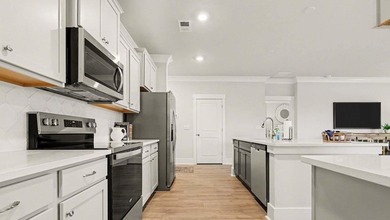 *4 bedrooms, 2.5 baths *Welcoming front porch and screened in - photo 10