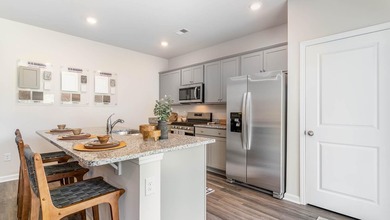 Experience the Kerry floor plan offering an open layout, 9 foot - photo 6