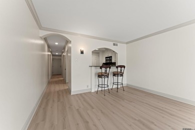 UNIT 105 - BEAUTIFUL FIRST FLOOR UNIT. DOWNTOWN LIVING AT ITS - photo 3