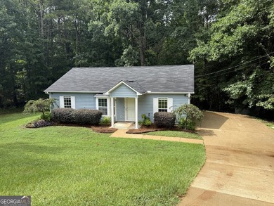 PRIVACY, CHARM, AND MOVE-IN READY LIVING COME TOGETHER! Tucked - photo 1