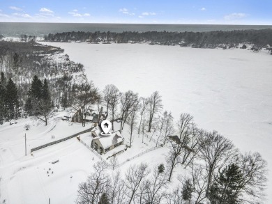 Just over half an acre with 125 ft private Bar Lake frontage - Lake Home Sale Pending in Manistee, Michigan