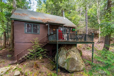 Nestled among towering pines on the shores of Buck Island on - photo 7