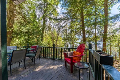 Nestled among towering pines on the shores of Buck Island on - photo 9