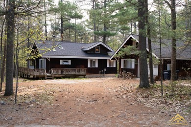 Tucked among the pines of Au Sable Acres, this fully furnished - photo 1