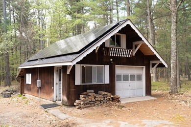 Tucked among the pines of Au Sable Acres, this fully furnished - photo 2