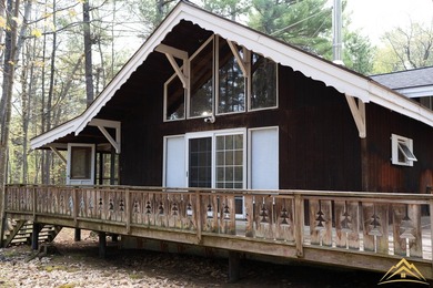 Tucked among the pines of Au Sable Acres, this fully furnished - photo 3