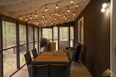 Tucked among the pines of Au Sable Acres, this fully furnished - photo 4