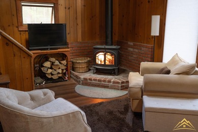 Tucked among the pines of Au Sable Acres, this fully furnished - photo 7